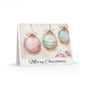 Christmas card with pastel-colored ornaments and 'Merry Christmas' text on a white background